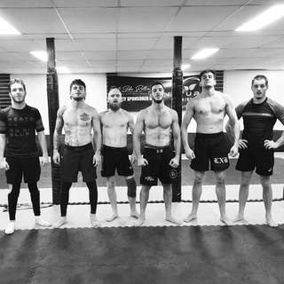 The East Side Rolling crew lined up on the mats